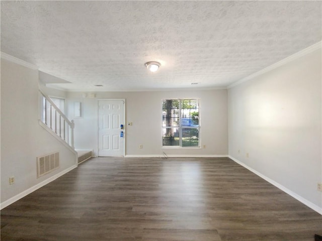 interior space featuring a textured ceiling, ornamental molding, and dark wood-type flooring