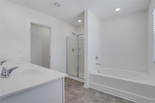 bathroom with plus walk in shower and vanity