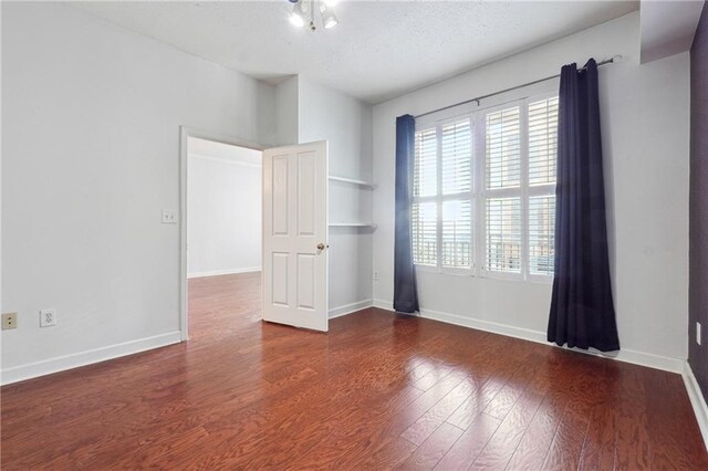 unfurnished bedroom featuring a closet, ceiling fan, and hardwood / wood-style flooring