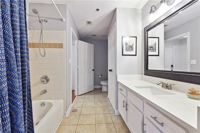 bathroom featuring shower / bath combination with curtain, visible vents, toilet, vanity, and tile patterned flooring