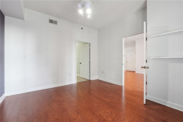 spare room featuring wood-type flooring