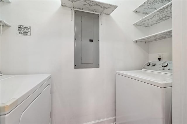 clothes washing area featuring washing machine and clothes dryer and electric panel