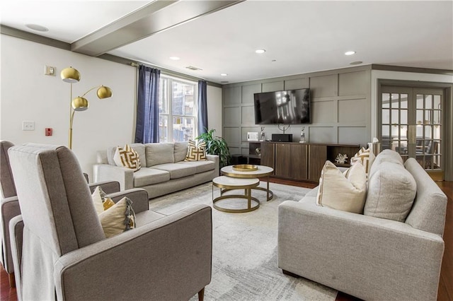 living area featuring french doors, visible vents, and recessed lighting