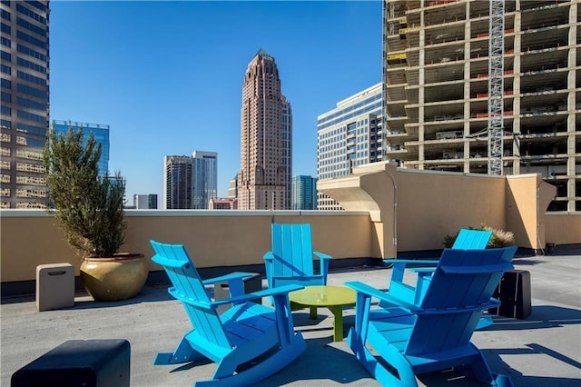 view of patio / terrace featuring a city view