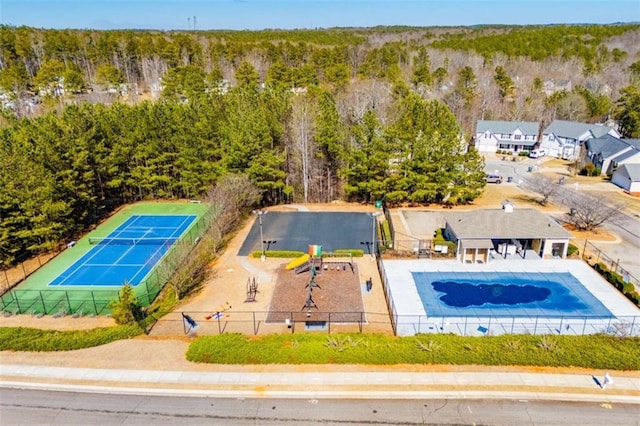 drone / aerial view featuring a view of trees