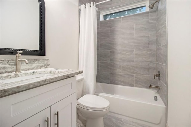 bathroom featuring shower / bath combination with curtain, vanity, and toilet