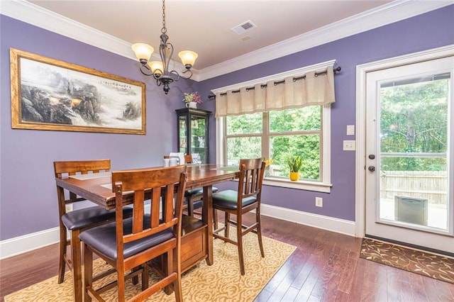 139 Village Park Dr, Newnan, GA 30265 - dining room with plenty of natural light, a chandelier, hardwood / wood-style flooring, and crown molding