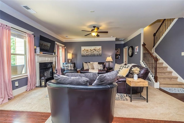 139 Village Park Dr, Newnan, GA 30265 - living area with stairs, ceiling fan, a fireplace, wood-type flooring, and crown molding