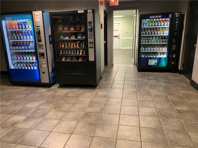 bar with tile patterned flooring and freestanding refrigerator