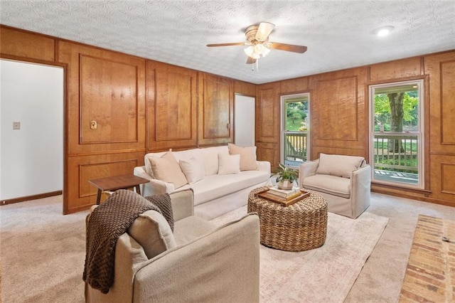 786 Mitsy Pt, Marietta, GA 30068 - living room with light carpet, a ceiling fan, and wood walls