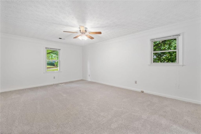 786 Mitsy Pt, Marietta, GA 30068 - empty room featuring crown molding, ceiling fan, light colored carpet, and a textured ceiling