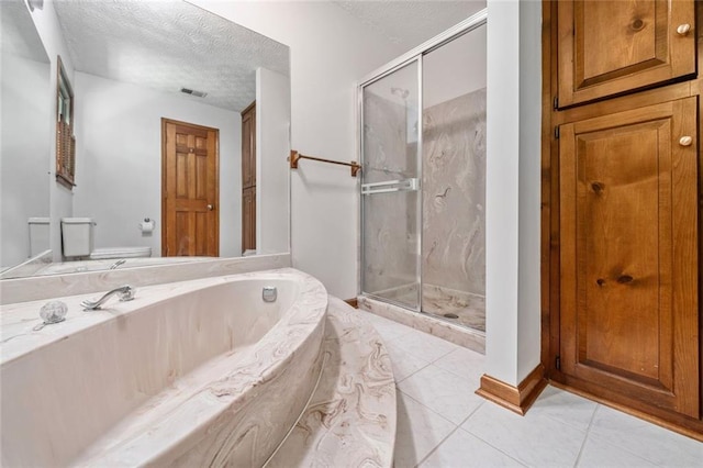 786 Mitsy Pt, Marietta, GA 30068 - full bathroom featuring a marble finish shower, a textured ceiling, a garden tub, and tile patterned flooring