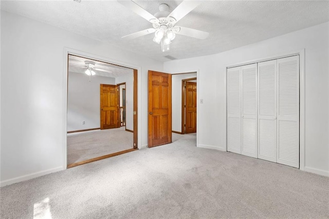 786 Mitsy Pt, Marietta, GA 30068 - unfurnished bedroom featuring carpet floors, a closet, a textured ceiling, and a ceiling fan