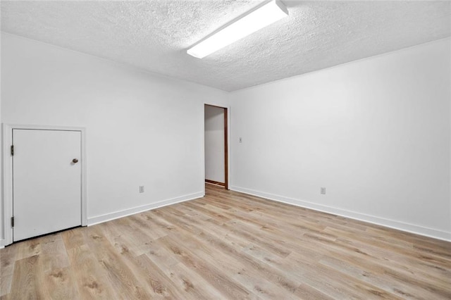 786 Mitsy Pt, Marietta, GA 30068 - spare room with a textured ceiling and light wood-style flooring