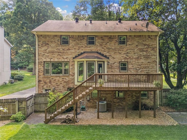 786 Mitsy Pt, Marietta, GA 30068 - back of property featuring stairs, a deck, a fenced backyard, and brick siding