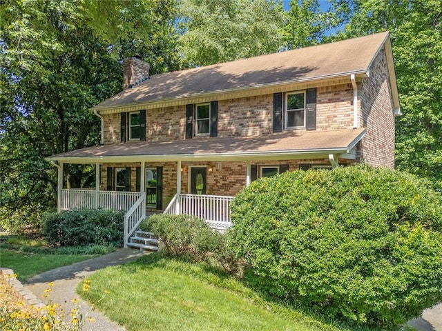 786 Mitsy Pt, Marietta, GA 30068 - view of front of house featuring a chimney, brick siding, and covered porch