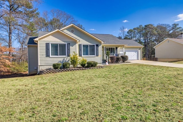 view of front of property with a front yard and a garage