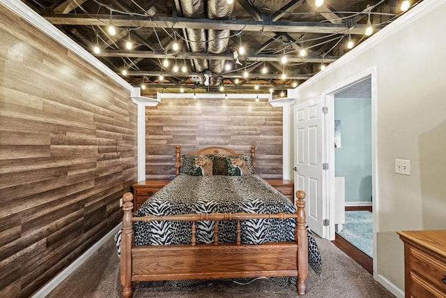 carpeted bedroom with rustic walls and wood walls