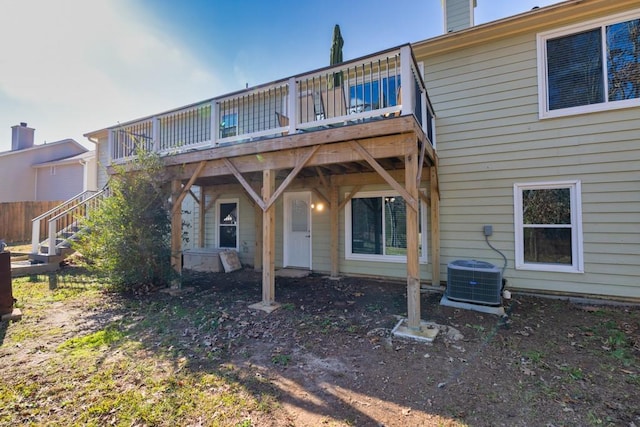 back of house with central AC and a wooden deck