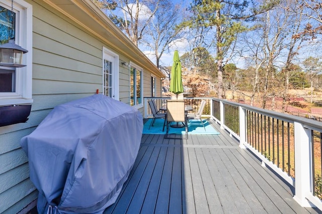 wooden deck featuring area for grilling