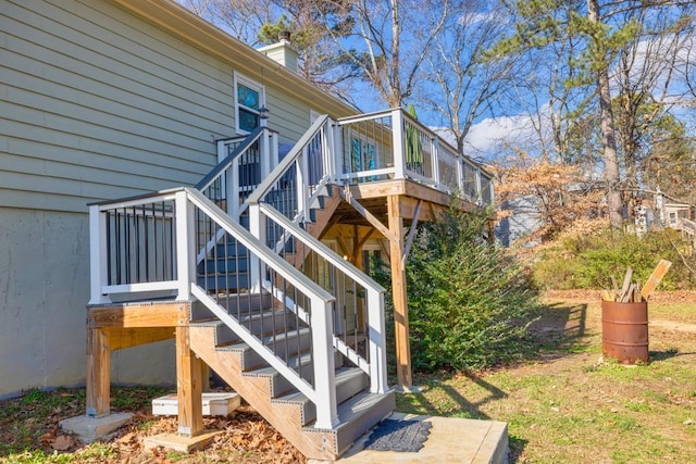 view of side of home with a wooden deck