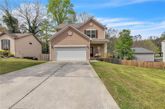 traditional home featuring concrete driveway, fence, and a front yard