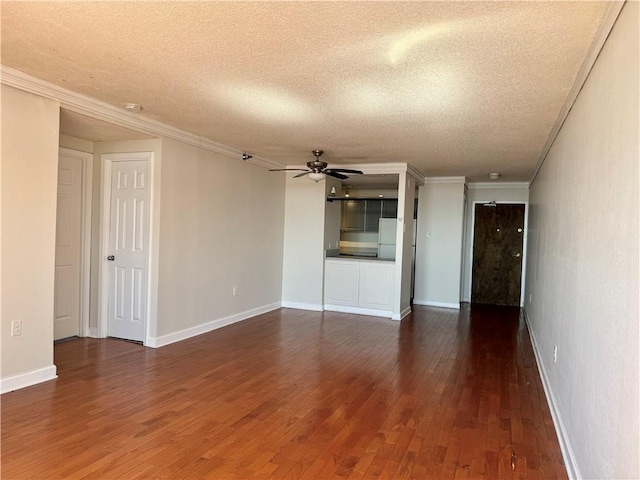 unfurnished living room with a textured ceiling, hardwood / wood-style flooring, ornamental molding, and ceiling fan