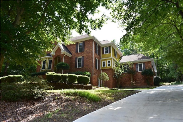 view of front of house featuring brick siding