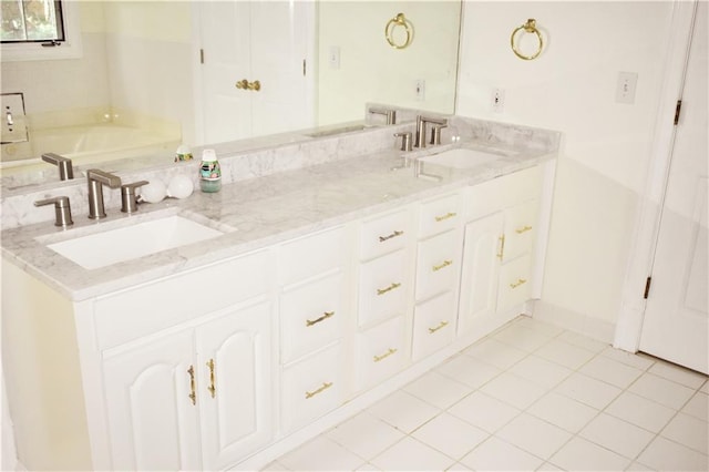 bathroom with a sink, a tub, and double vanity