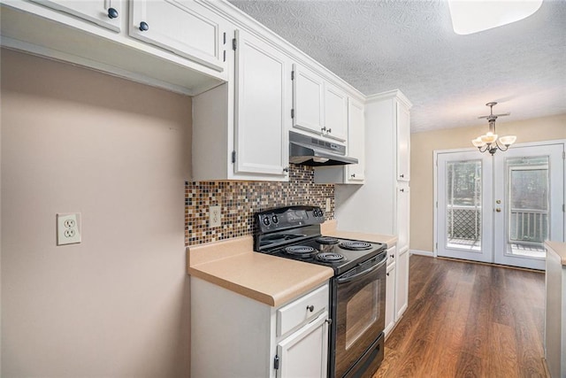 kitchen with pendant lighting, backsplash, dark wood-type flooring, black range with electric cooktop, and white cabinetry