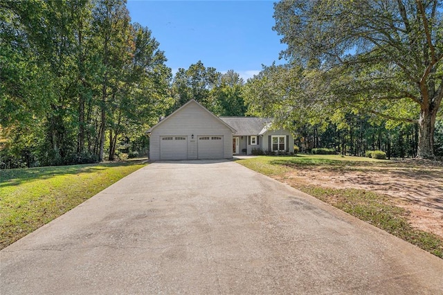 view of front of property with a garage and a front yard