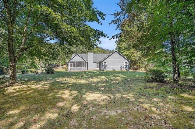 view of yard with a sunroom