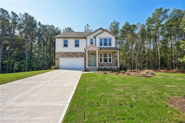 view of front of home featuring a front lawn and a garage