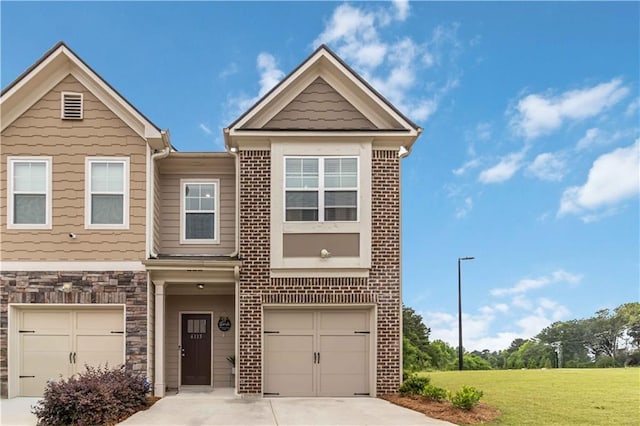 view of property featuring an attached garage, concrete driveway, a front yard, and stone siding