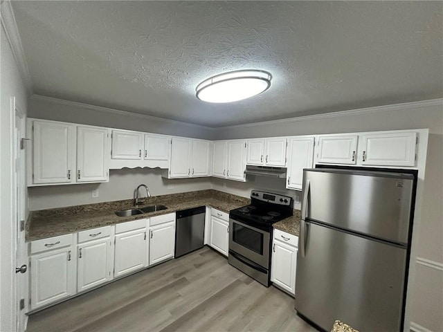 kitchen with white cabinetry and appliances with stainless steel finishes