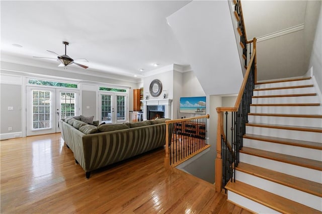 1255 Beech Haven Rd NE, Atlanta, GA 30324 - living area with french doors, ceiling fan, light wood finished floors, ornamental molding, and baseboards