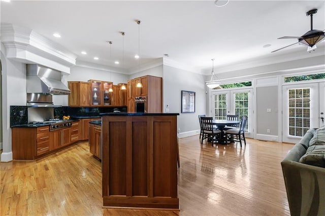 1255 Beech Haven Rd NE, Atlanta, GA 30324 - kitchen with french doors, stainless steel appliances, wall chimney range hood, dark countertops, and glass insert cabinets