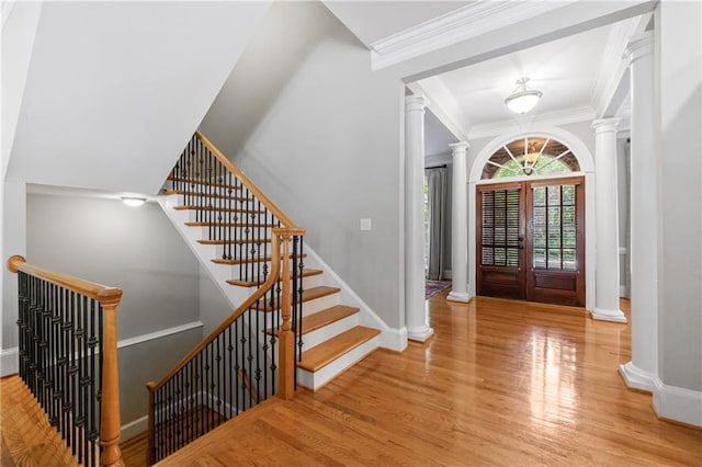 1255 Beech Haven Rd NE, Atlanta, GA 30324 - foyer featuring ornate columns, wood finished floors, crown molding, and baseboards