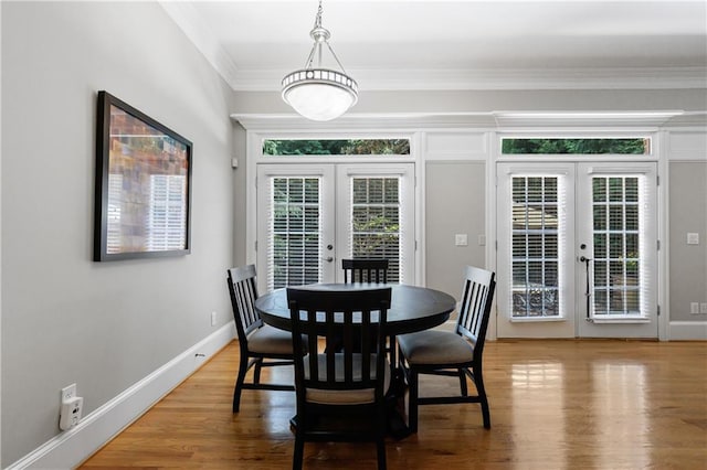 1255 Beech Haven Rd NE, Atlanta, GA 30324 - dining area featuring french doors, wood finished floors, ornamental molding, and baseboards