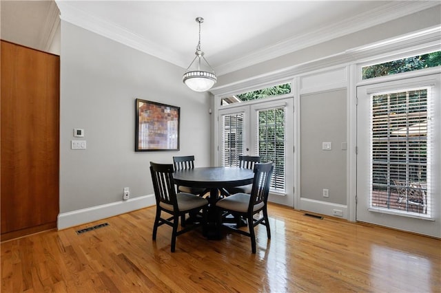 1255 Beech Haven Rd NE, Atlanta, GA 30324 - dining room featuring ornamental molding, light wood-type flooring, and baseboards