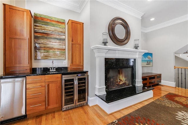 1255 Beech Haven Rd NE, Atlanta, GA 30324 - indoor wet bar featuring beverage cooler, crown molding, light wood-type flooring, recessed lighting, and stainless steel dishwasher