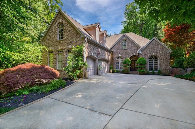 1255 Beech Haven Rd NE, Atlanta, GA 30324 - view of front of home featuring driveway, a garage, and brick siding