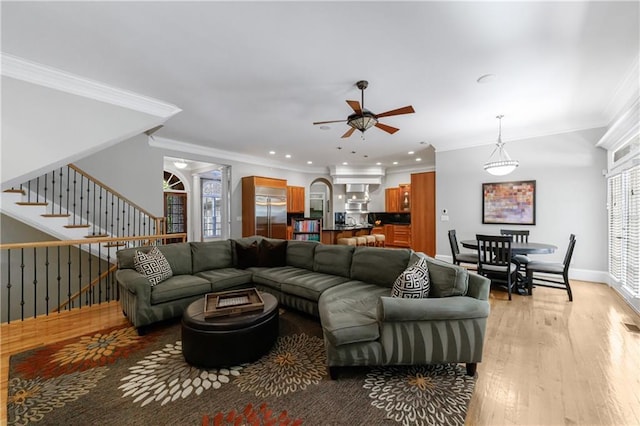 1255 Beech Haven Rd NE, Atlanta, GA 30324 - living area featuring ceiling fan, light wood-type flooring, crown molding, stairway, and recessed lighting