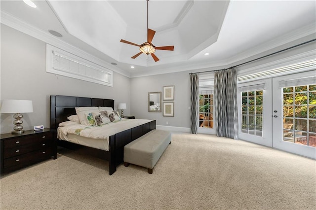 1255 Beech Haven Rd NE, Atlanta, GA 30324 - bedroom featuring a tray ceiling, ornamental molding, access to exterior, light colored carpet, and multiple windows