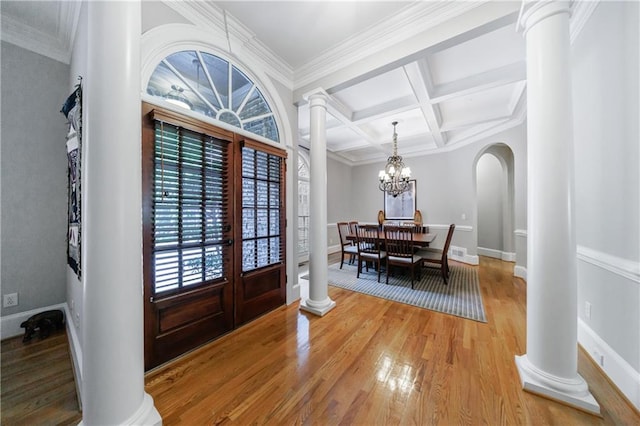 1255 Beech Haven Rd NE, Atlanta, GA 30324 - foyer with decorative columns, light wood-style floors, beamed ceiling, coffered ceiling, and a chandelier