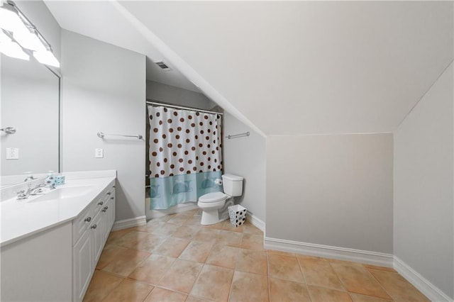 1255 Beech Haven Rd NE, Atlanta, GA 30324 - bathroom featuring vanity, toilet, vaulted ceiling, tile patterned floors, and baseboards