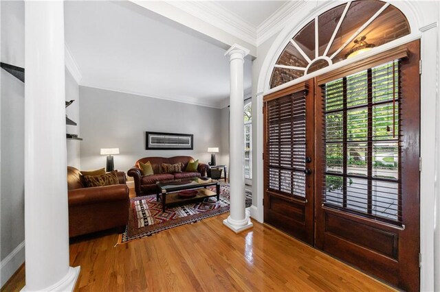 1255 Beech Haven Rd NE, Atlanta, GA 30324 - foyer with decorative columns, ornamental molding, wood finished floors, and baseboards