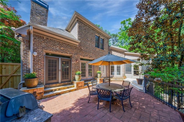 1255 Beech Haven Rd NE, Atlanta, GA 30324 - view of patio with entry steps, french doors, and a grill
