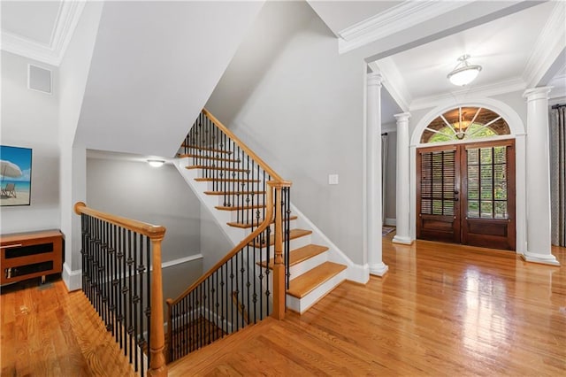 1255 Beech Haven Rd NE, Atlanta, GA 30324 - entryway with decorative columns, ornamental molding, wood finished floors, and baseboards