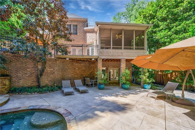 1255 Beech Haven Rd NE, Atlanta, GA 30324 - back of property with french doors, a sunroom, a patio, brick siding, and ceiling fan
